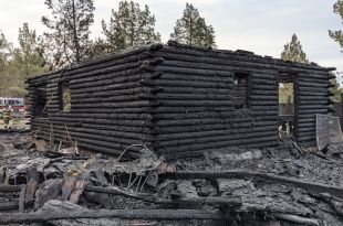 Dog awakens Crooked River Ranch resident who escapes fire that destroyed log home