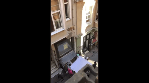Watch: People Unite to Rescue a Dog from A Building’s Ledge